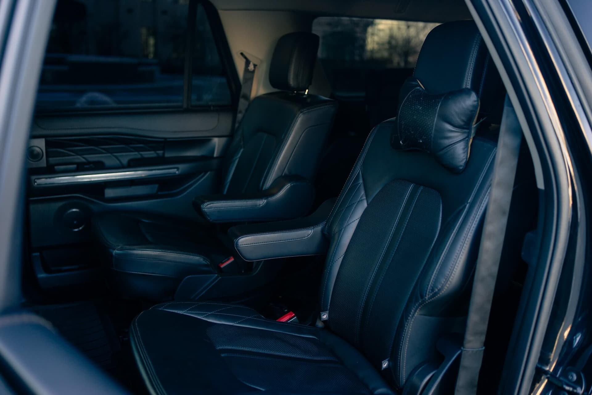 Black Ford Expedition Max in a dark studio with warm rim light